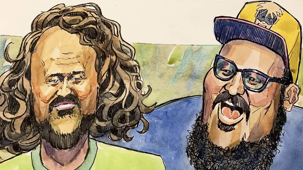 Dick Masterson and Vito painted in watercolour, head and shoulders side by side -- one with long curly hair and a beard, the other in a snapback and blue-framed glasses, caught mid-sentence