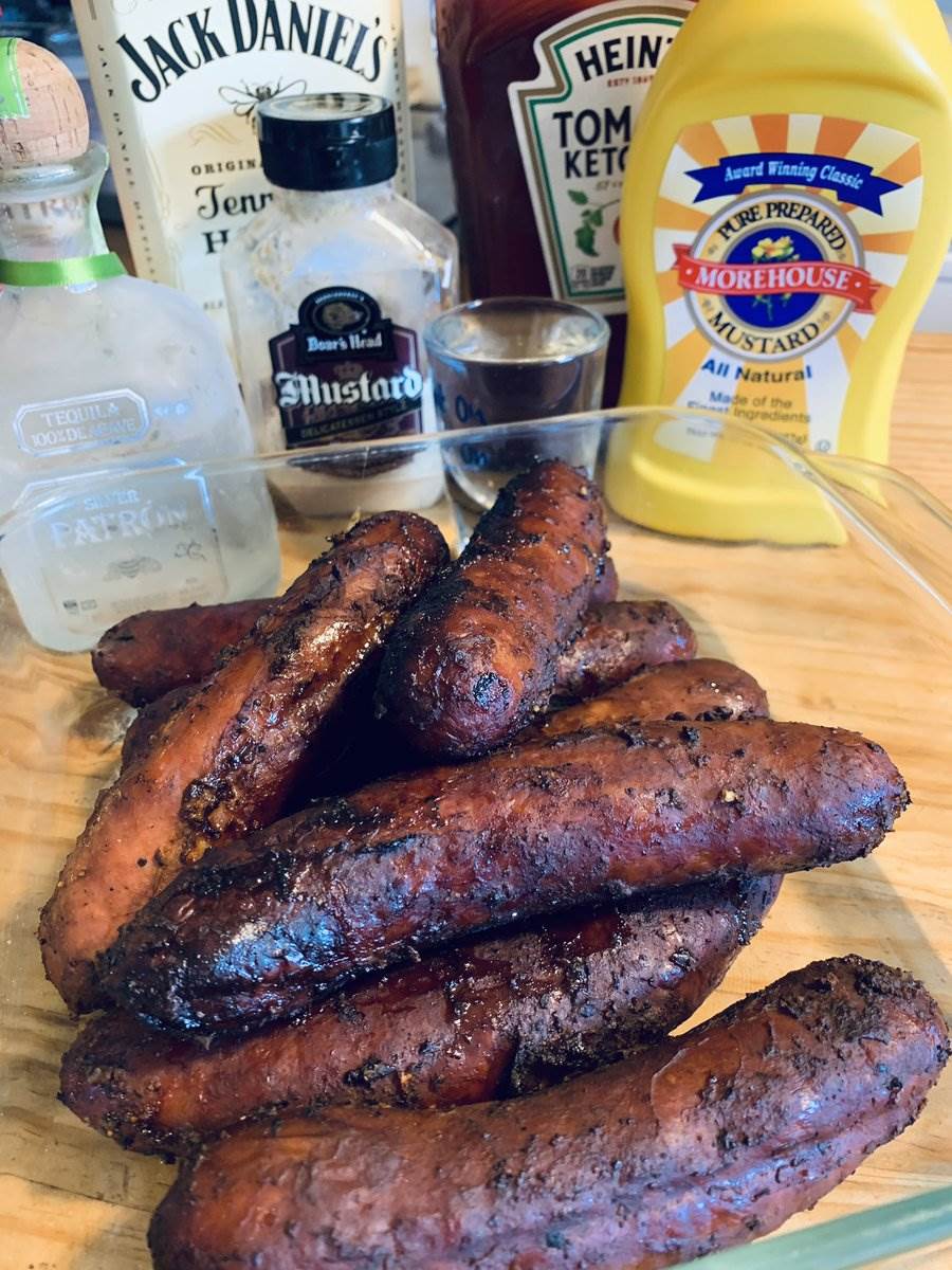 A tray of smoked bratwurst with the bar behind, 2024 — photograph by Ray Patrick