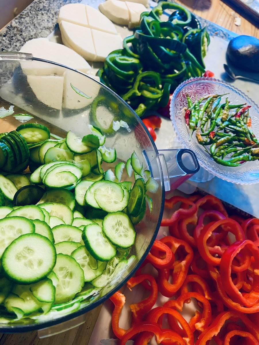 Cucumber, peppers and chillies prepped for pickling, 2025 — photograph by Ray Patrick