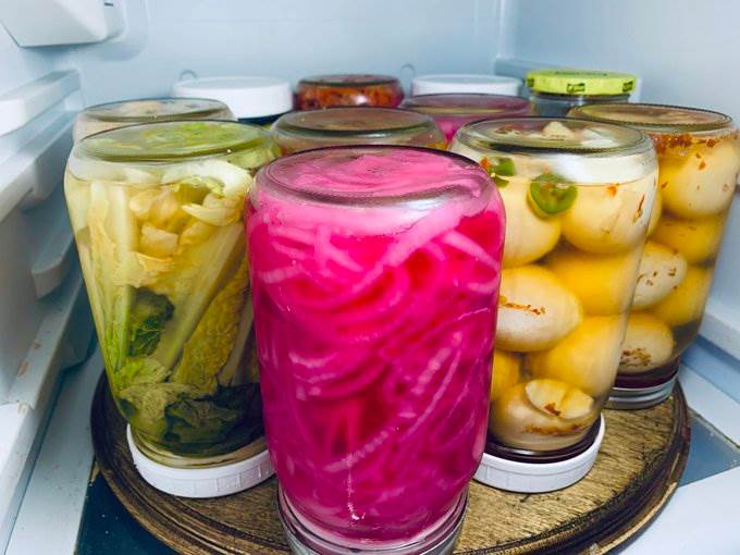 Jars of pickles on a fridge turntable, 2025 — photograph by Ray Patrick