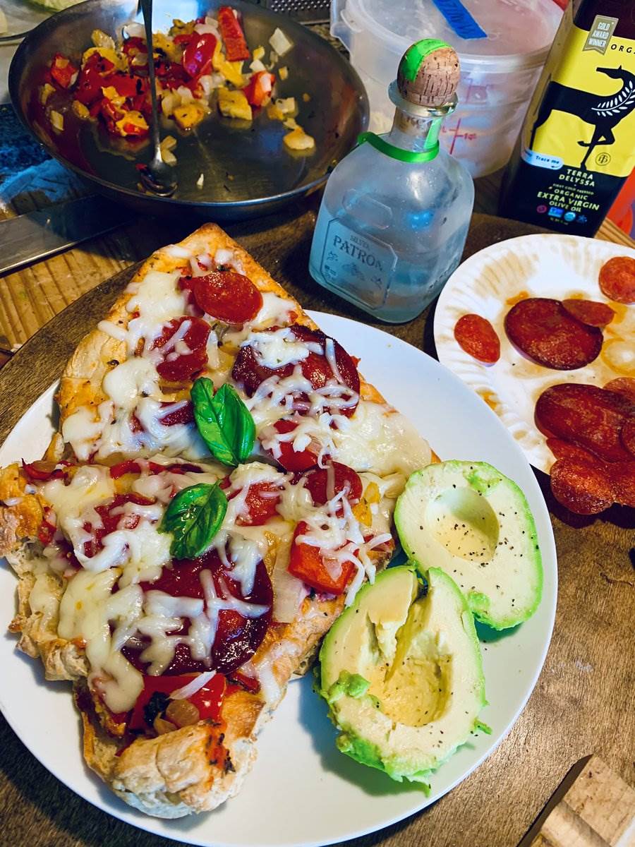 Pepperoni pizza slices with avocado halves, 2025 — photograph by Ray Patrick