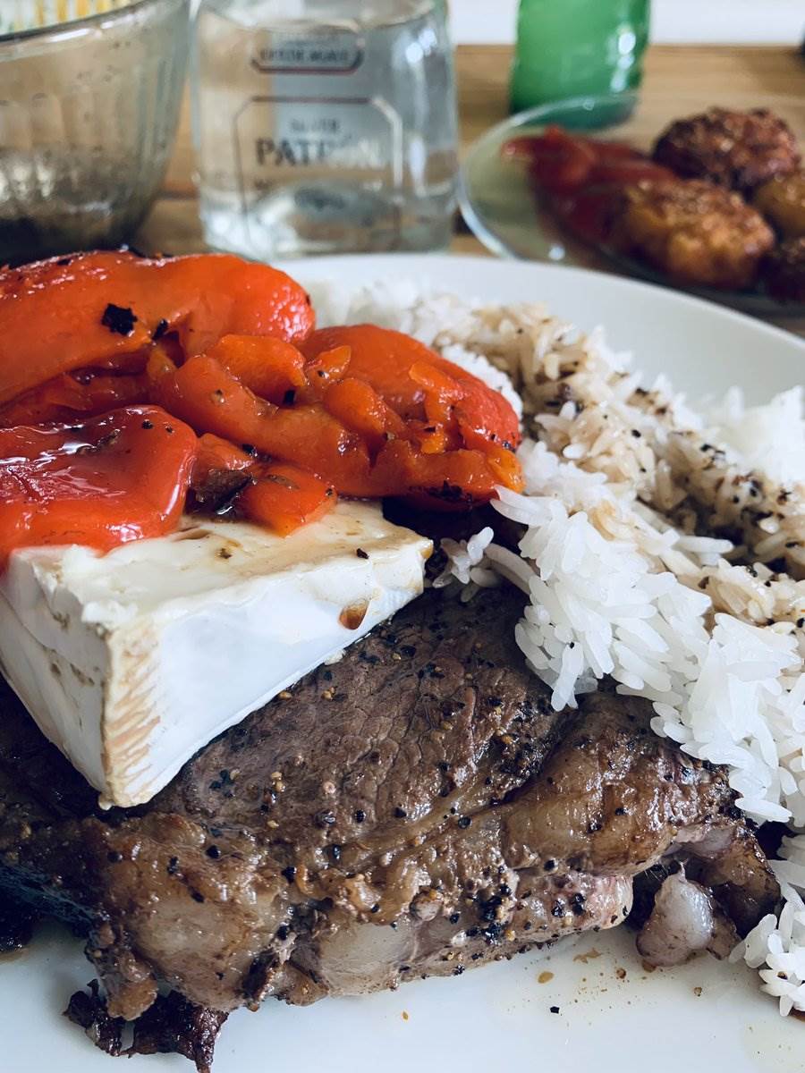 Ribeye under brie and pickled red peppers with rice, 2025 — photograph by Ray Patrick