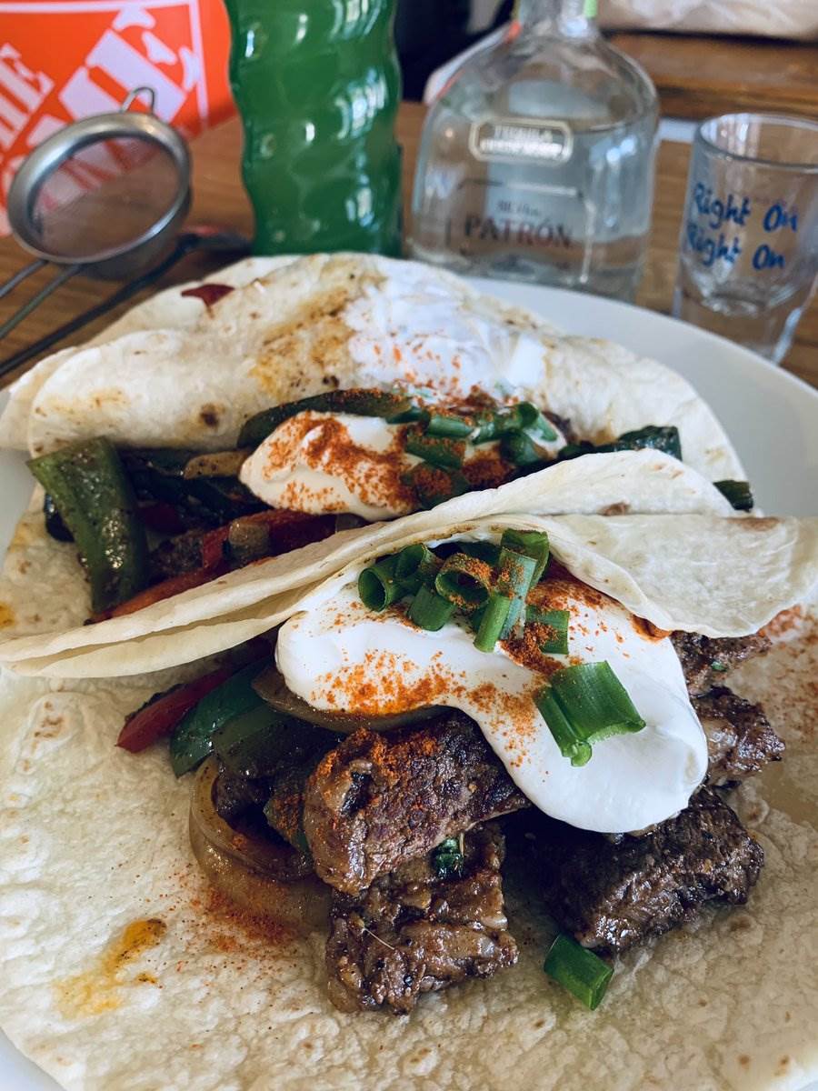 Two ribeye fajitas under sour cream and paprika, 2025 — photograph by Ray Patrick