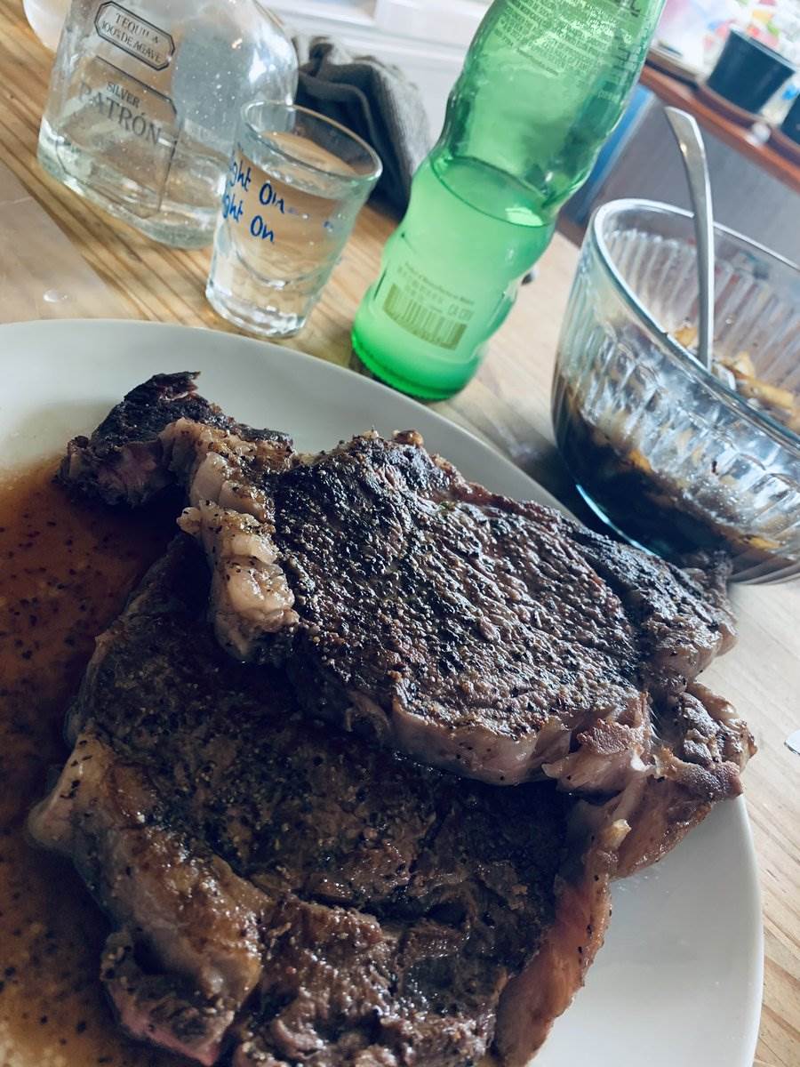 Two ribeyes resting in their own juices, 2024 — photograph by Ray Patrick